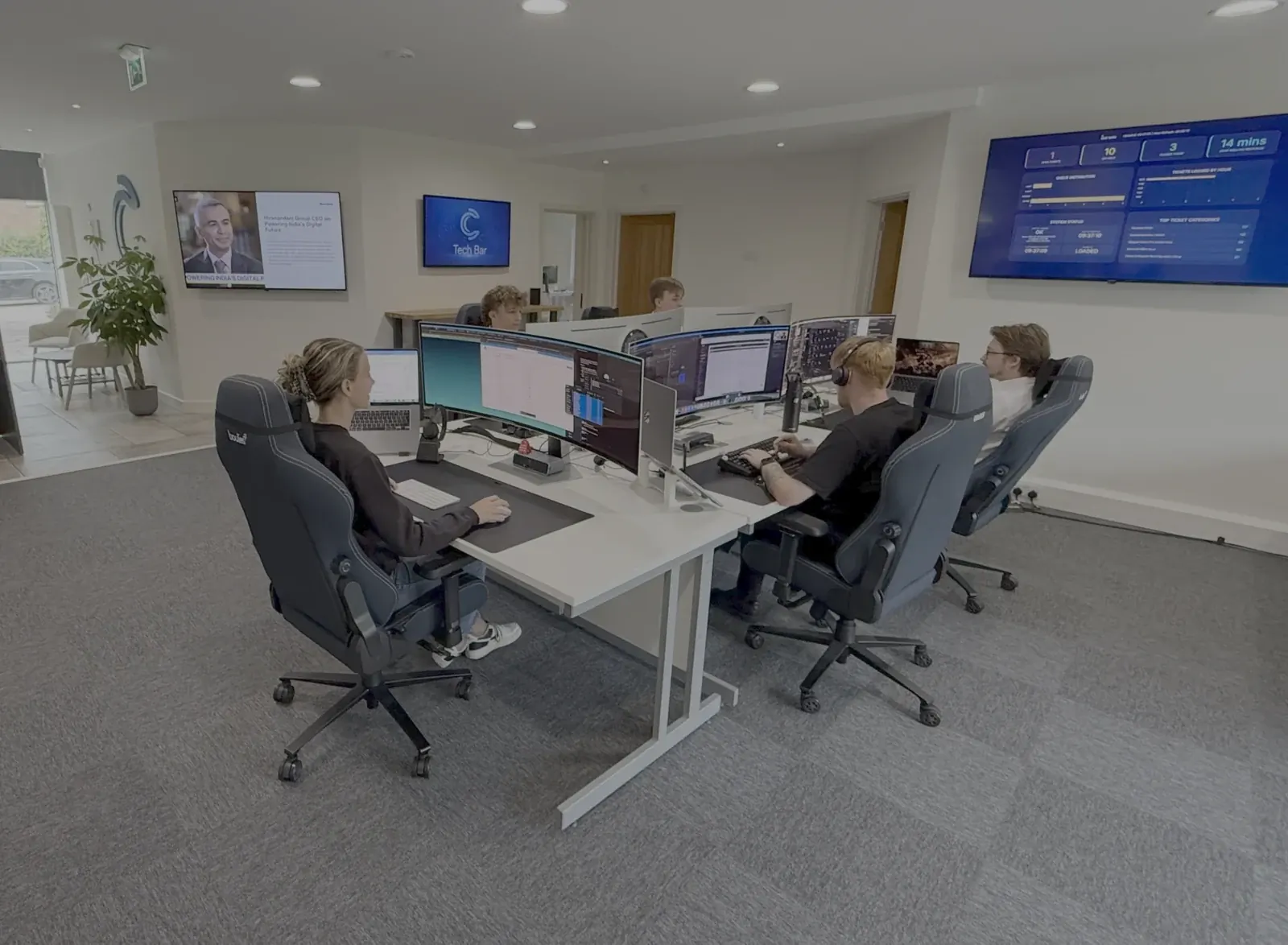 The We C2 IT engineering team at the service desk
