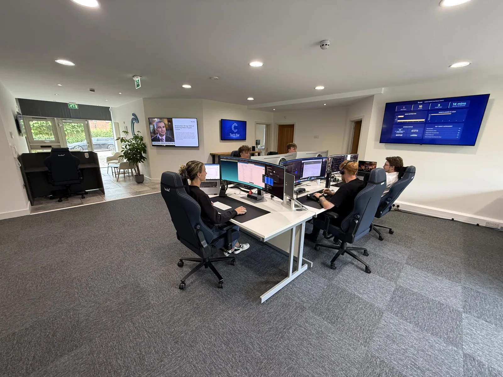 The We C2 IT engineering team at the service desk